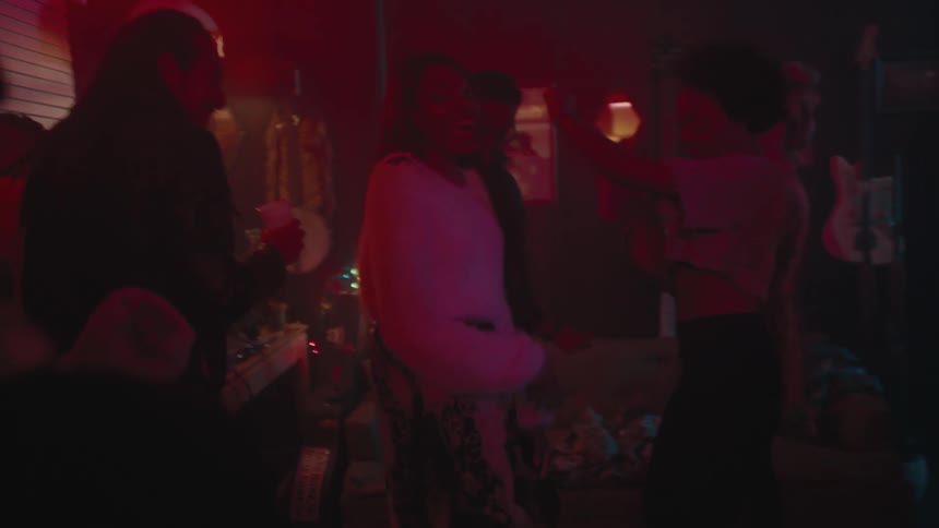 People dancing and drinking in a night club