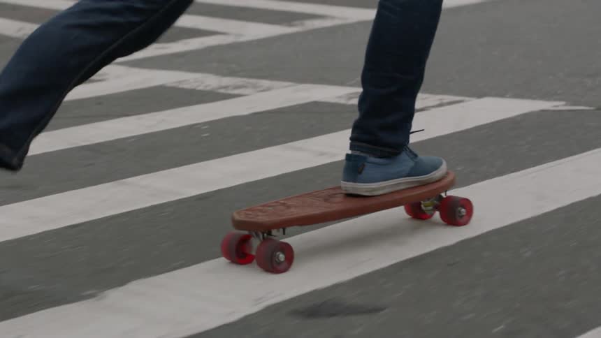 Person skateboarding on a city street