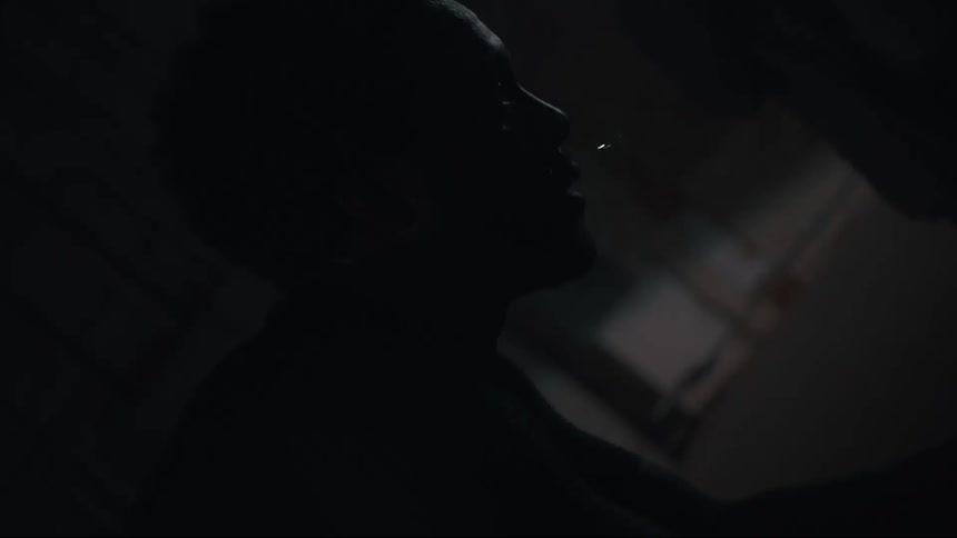 A man is working out in the dark room