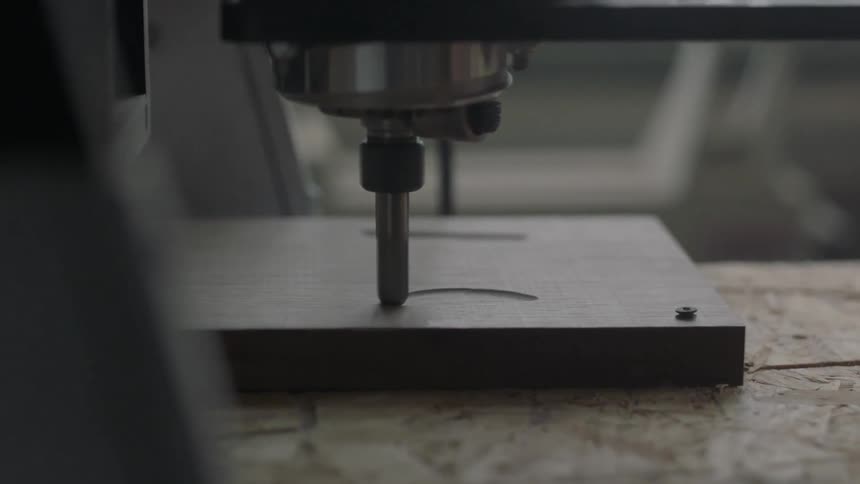 Machine carving a design into wood