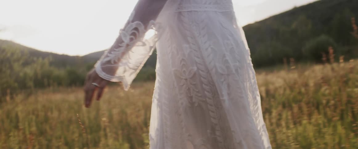 A view of a woman walking in a field