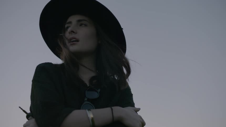 Woman wearing a hat on a clear day