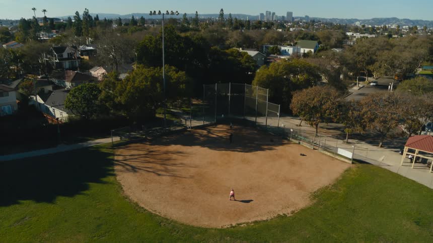 A single person is on the baseball field