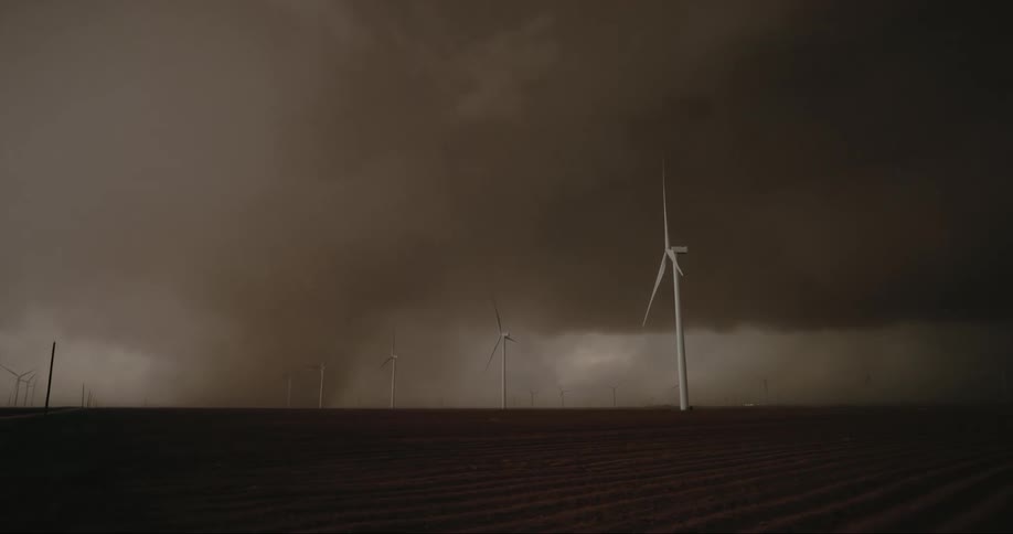 Its storming in a rural area at dusk