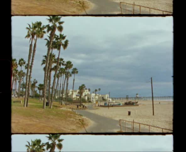 View of road and beach next to the ocean on coastal town