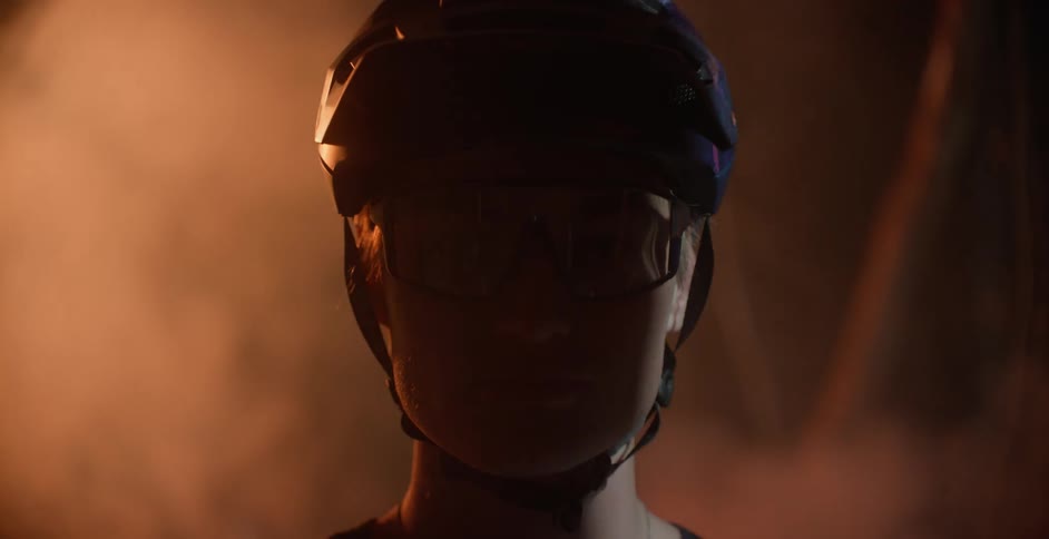 A person is wearing a helmet outdoors at night