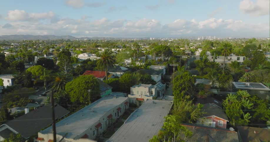 Housing neighborhood stretches to the cityand mountains in the distance
