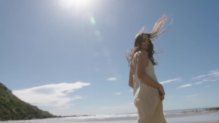 A woman is running on the beach