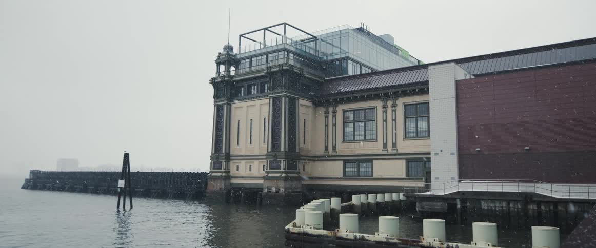 The facade of a building on the coast on a snowy day