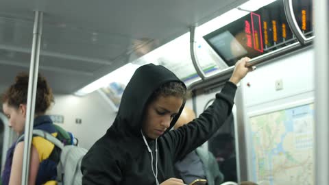Passengers ride on a subway