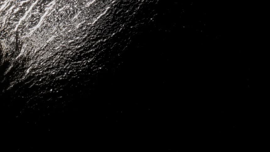 The water surface ripples and shimmers at night