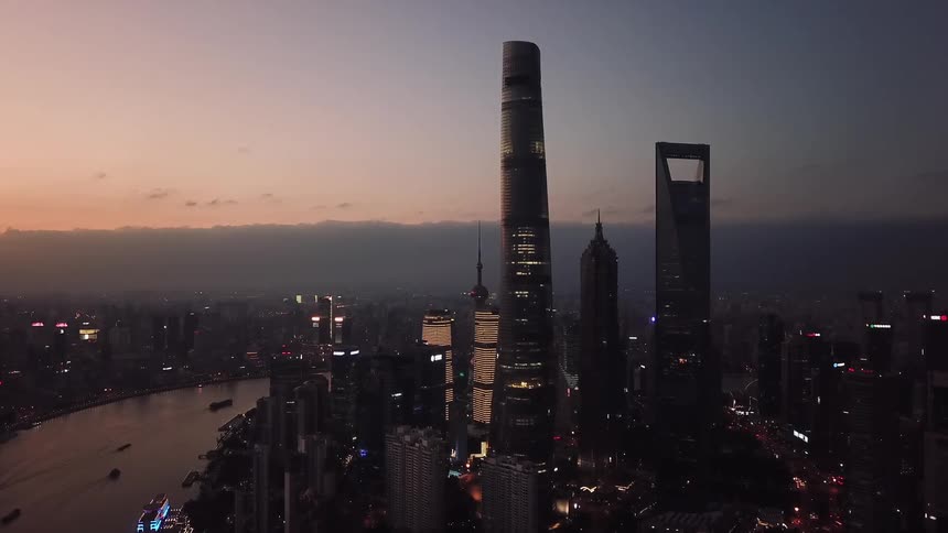 The shanghai china city skyline shimmering at dusk