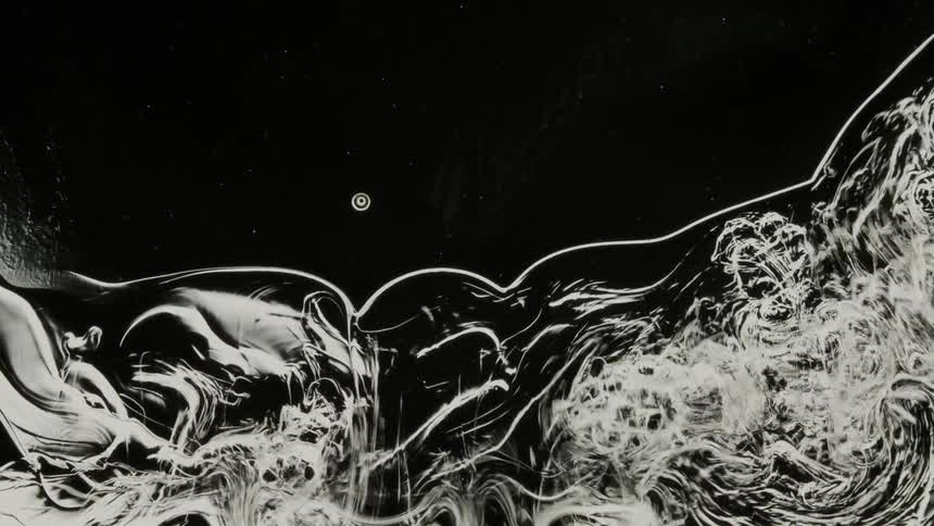 Viscous fluid is flowing and swirling around in a turbulent manner in this surreal scene