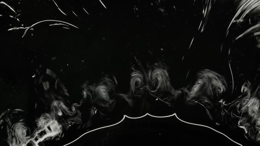 Abstract liquid swirls on black background