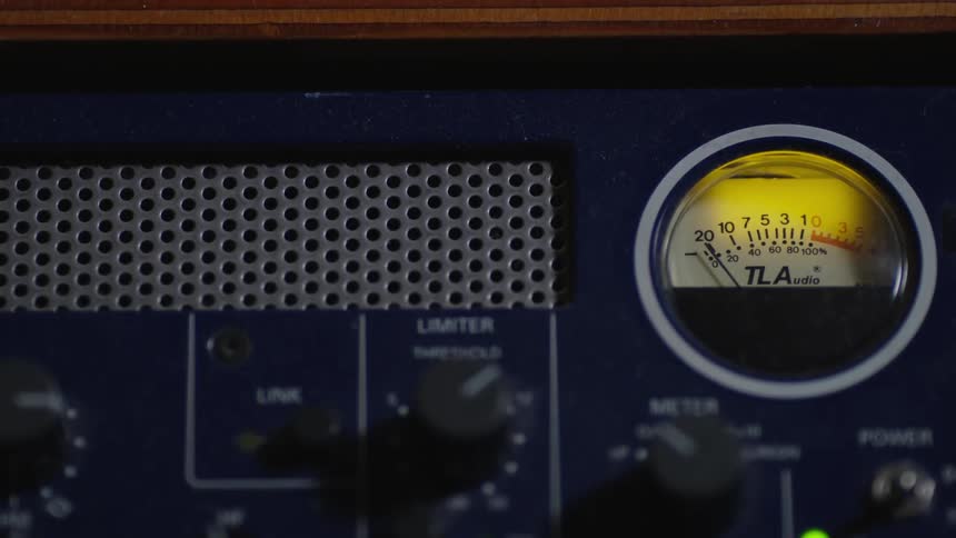 Person switching on a lighted meter on a panel