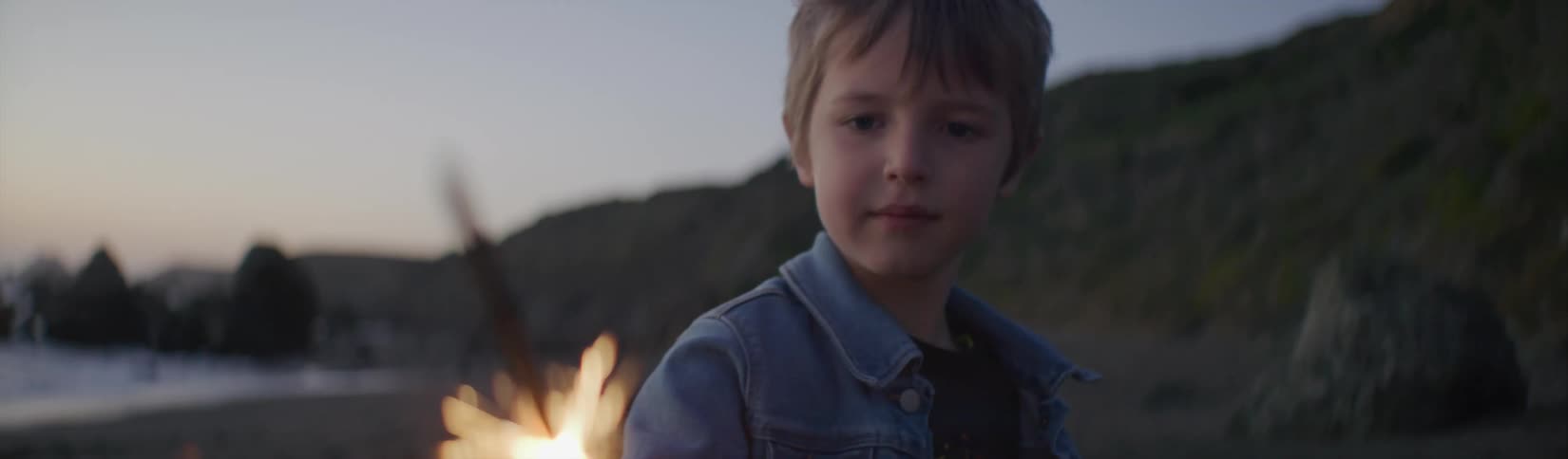 A view of a child playing with a sparkler