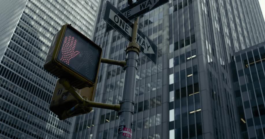 Traffic light in the downtown of big city changing from red to green