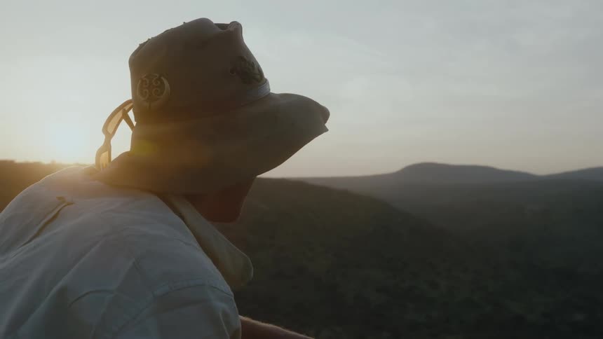 A man watches the sunrise