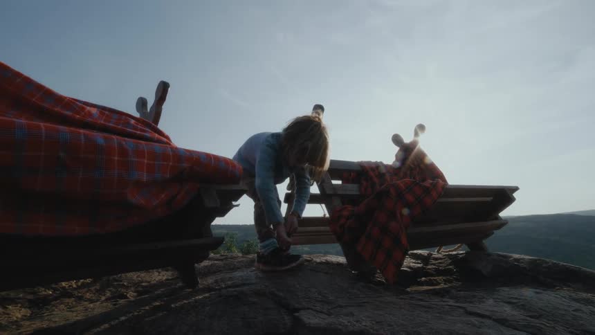 A view of a child putting on shoes
