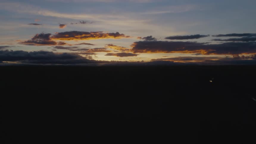 Wide open shots of the horizon is shown at dusk