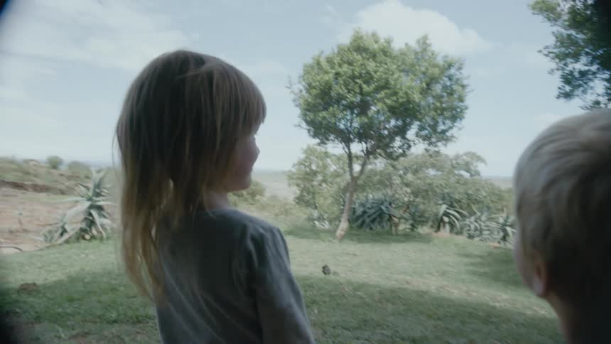 A family running around outdoors