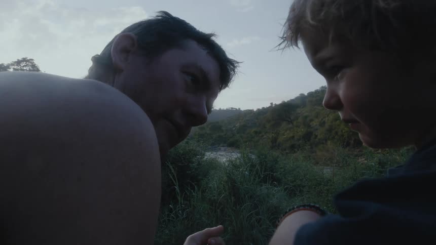 A father and son out in a forest