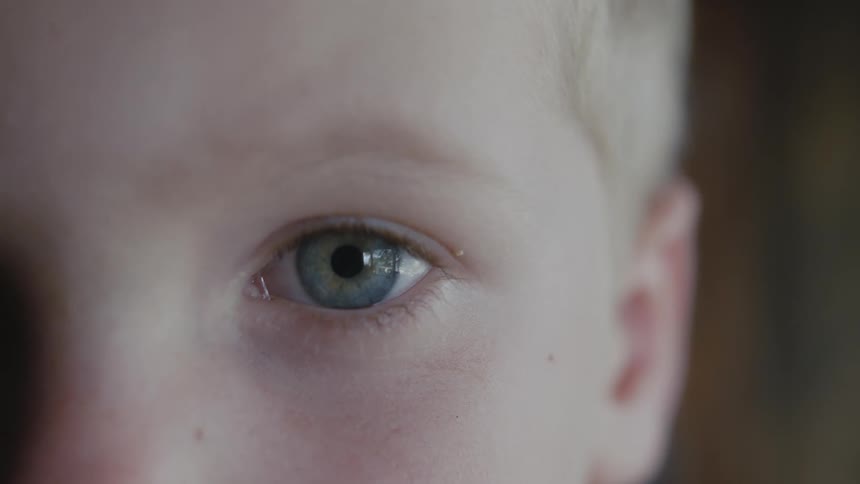 A blonde haired boy with blue eyes