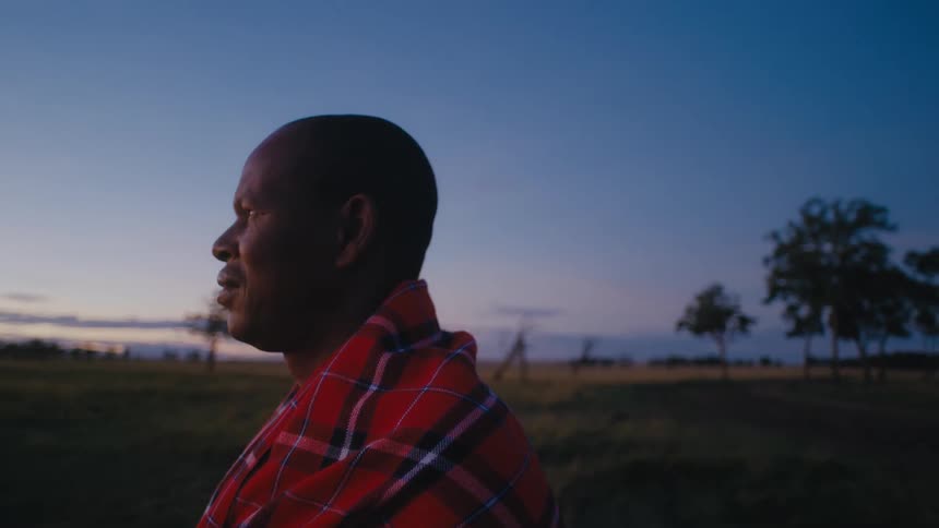 A man watches the sunrise