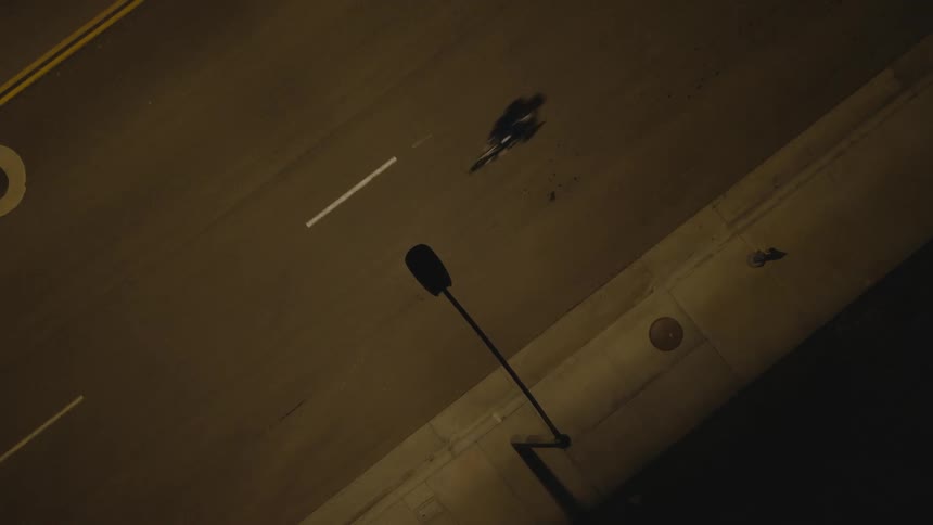 An aerial view of a person cycling