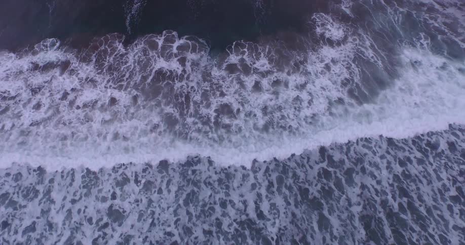 Aerial view of waves coming ashore