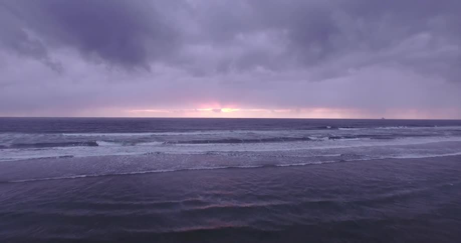 Moving over the coast at sunset on a cloudy day