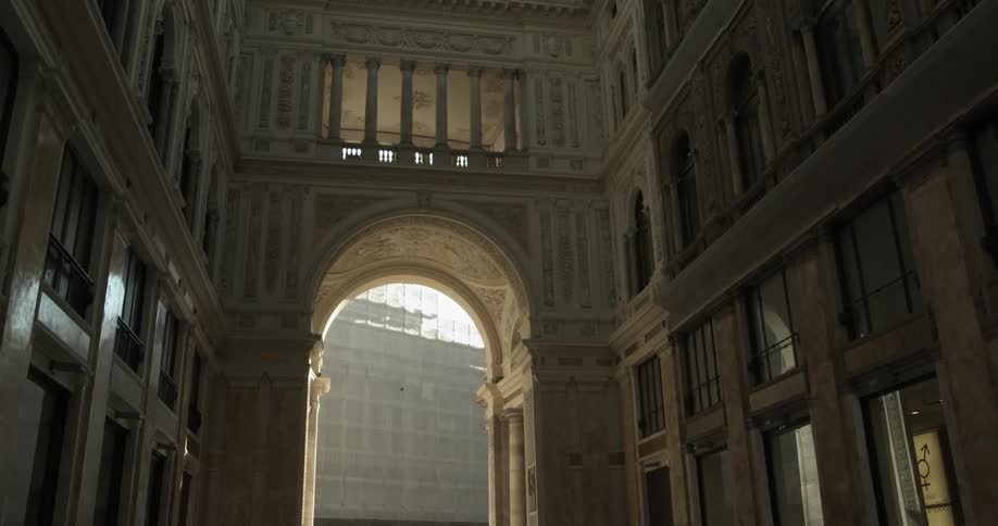 Building with an arched entryway and bars on the windows