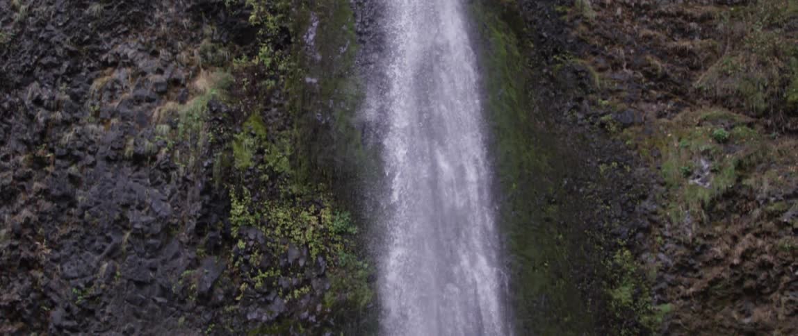 View of a tall waterfall pouring water below