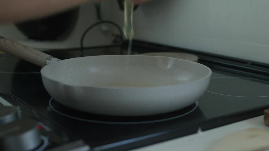 A person is cooking eggs