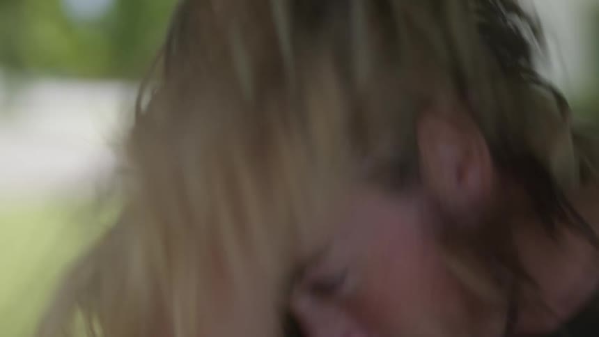 A man whips his hair around