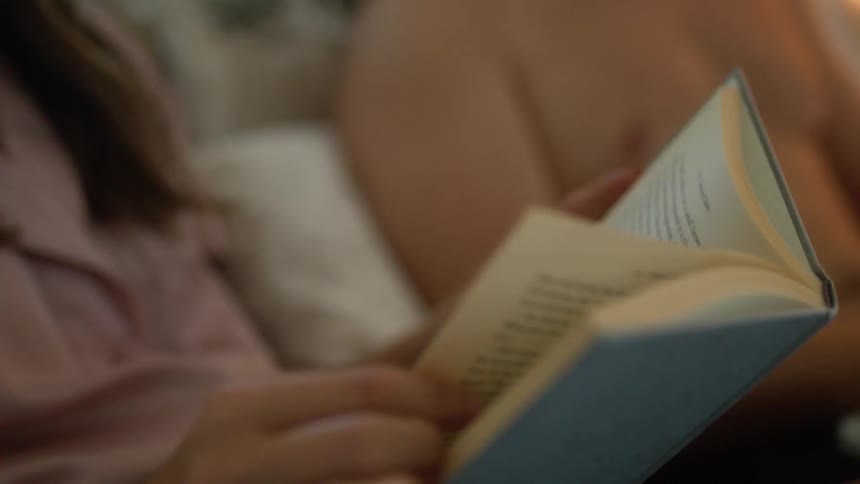 A woman is reading a book