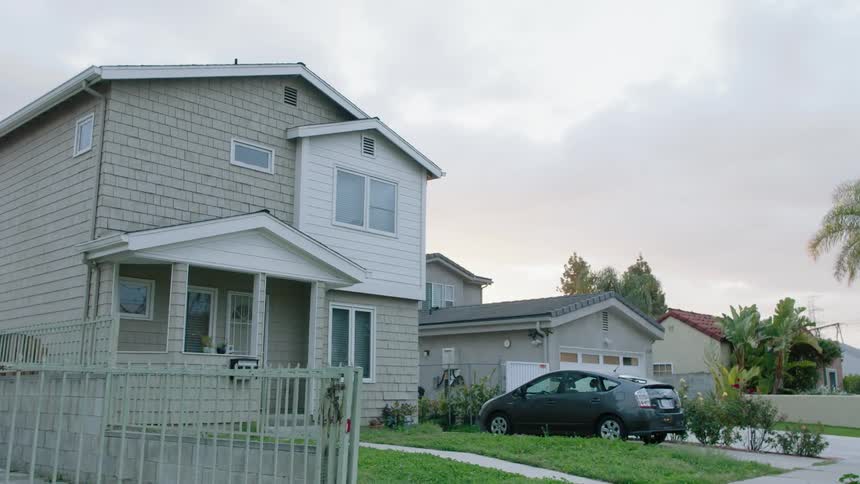 A car is parked in the driveway