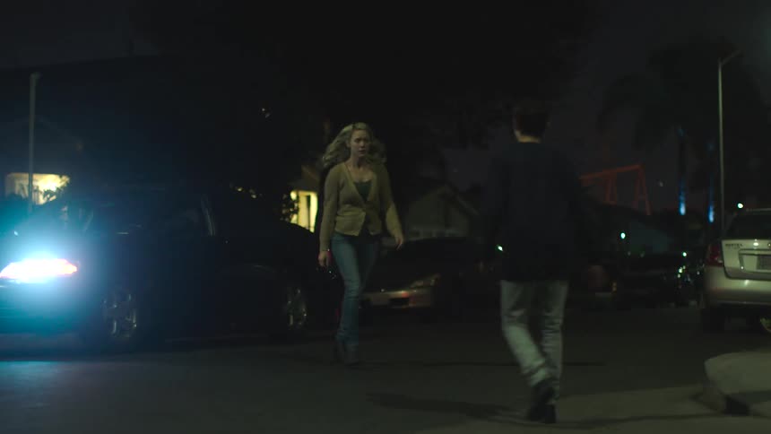 A mother finds her son and gets out of her car to hug him