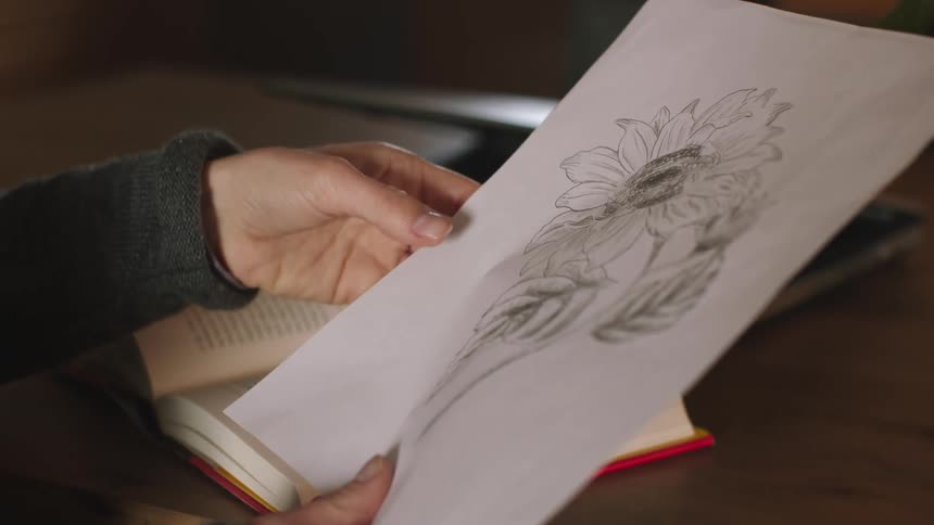 A person looks at a drawing