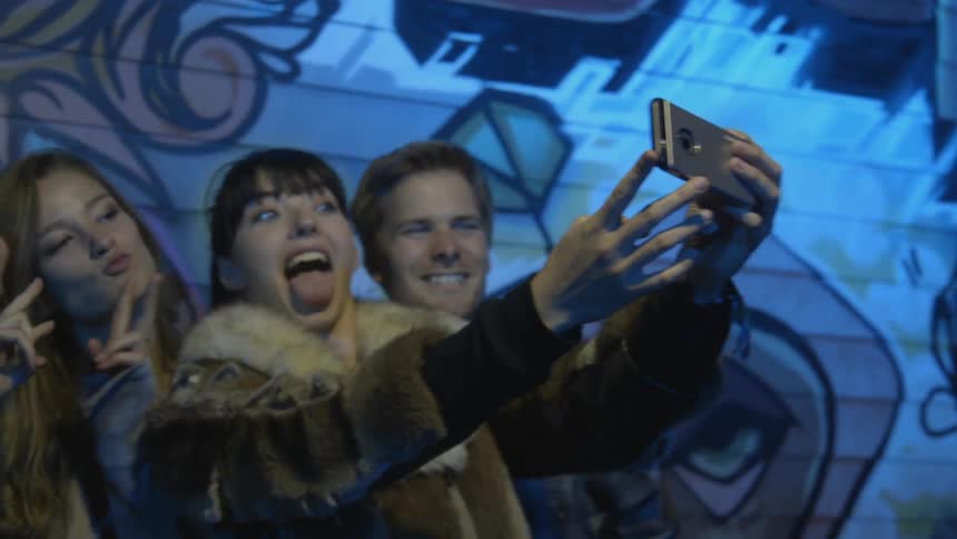 A group of friends take a selfie