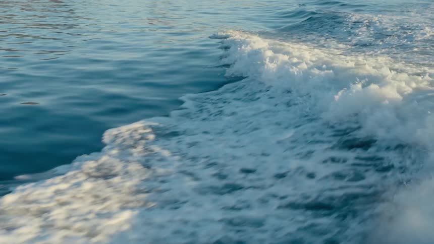Ocean water is being displaced causing foamy waves