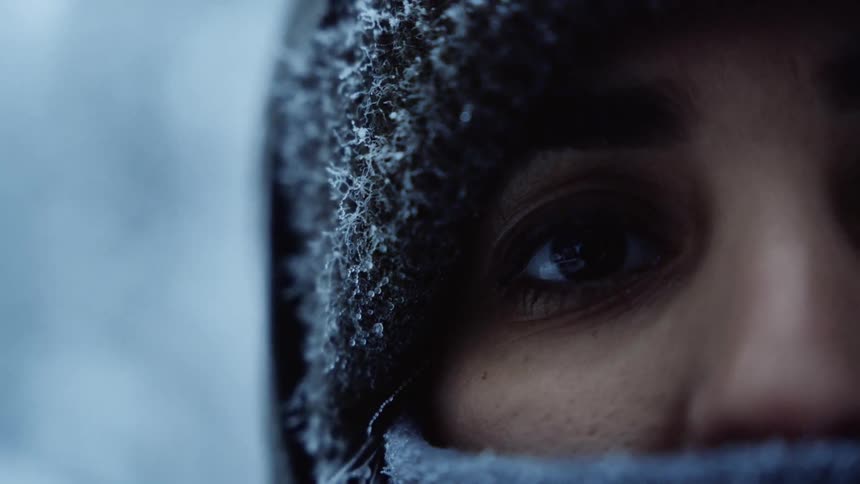 close up of a womans eye with ice