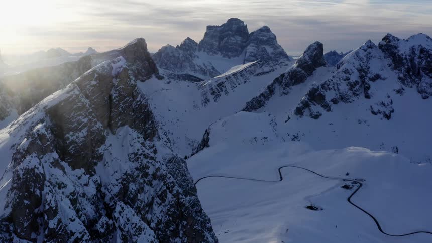 Aerial view of snow covered mountains are displayed