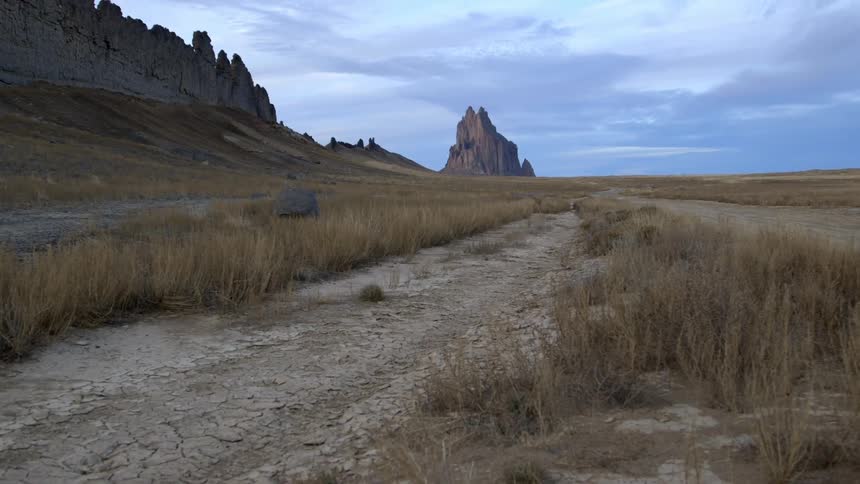 A mountain sits on the side of this small trail