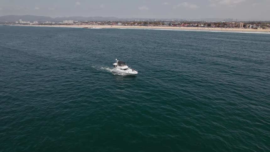 Water ripples as a ship sails near the coast