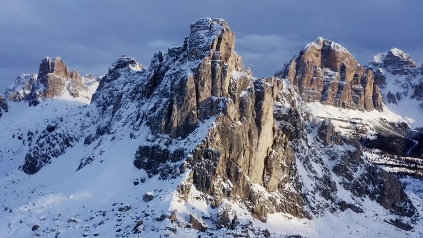 Aerial view of snow covered high mountains
