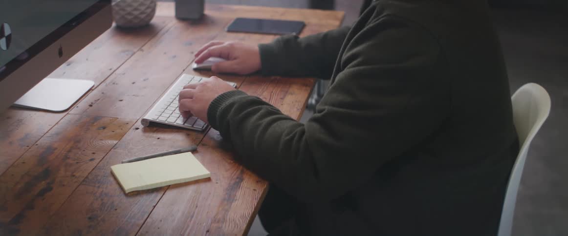 A man is working at his computer