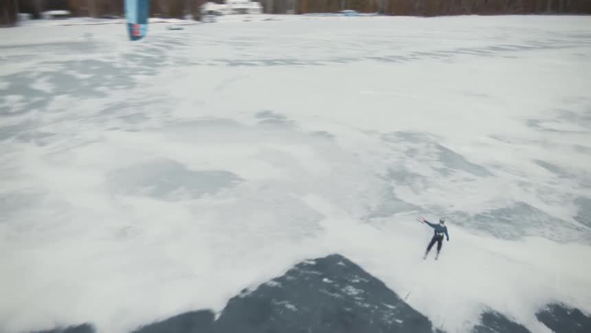 A person is skiing outdoors on a snow covered landscape