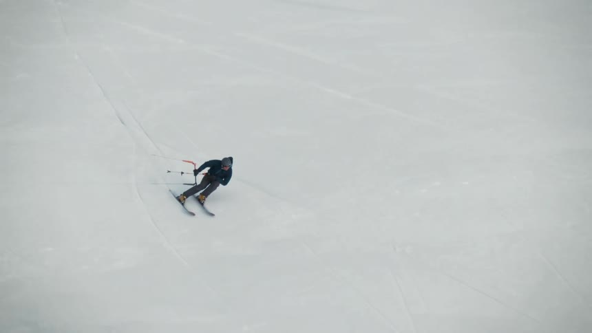A person is skiing on the frozen lake