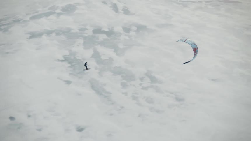 Skier speedriding over the snowy ground